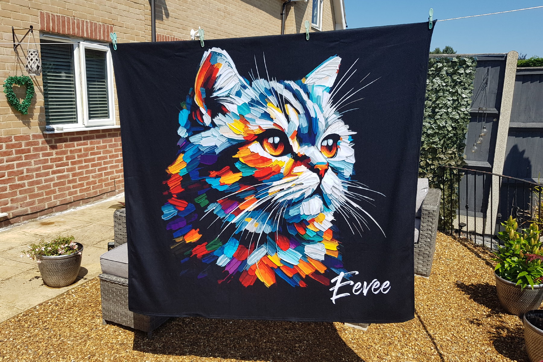 A Large Art Blanket featuring a vibrant colourful portrait of a British straight cat. 